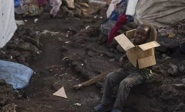 A child plays in the Bulengo refugee camp in Goma, Congo, after the World Health Organization had declared Thursday, Aug, 15, 2024, the increasing spread of mpox in Africa a global health emergency, warning the virus might ultimately spill across international borders. (AP Photo/Moses Sawasawa)