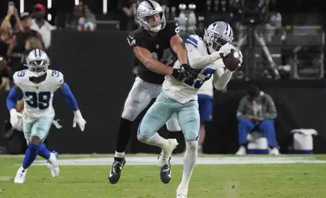 Dallas Cowboys cornerback Kemon Hall (43) intercepts a pass intended for Las Vegas Raiders tight end Harrison Bryant (84) during the second half of an NFL preseason football game, Saturday, Aug. 17, 2024, in Las Vegas. (AP Photo/Rick Scuteri)