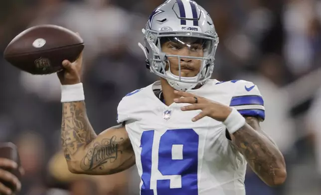 Dallas Cowboys quarterback Trey Lance warms up before an NFL preseason football game against the Las Vegas Raiders, Saturday, Aug. 17, 2024, in Las Vegas. (AP Photo/Steve Marcus)