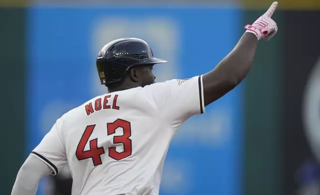 Cleveland Guardians' Jhonkensy Noel gestures as he runs the bases with a home run in the fourth inning of a baseball game against the Chicago Cubs Monday, Aug. 12, 2024, in Cleveland. (AP Photo/Sue Ogrocki)