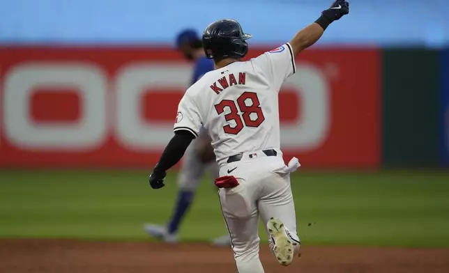 Cleveland Guardians' Steven Kwan gestures as he runs the bases with a home run in the fifth inning of a baseball game against the Chicago Cubs, Monday, Aug. 12, 2024, in Cleveland. (AP Photo/Sue Ogrocki)