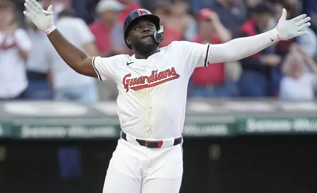 Cleveland Guardians' Jhonkensy Noel celebrates as he crosses home plate with a home run in the fourth inning of a baseball game against the Chicago Cubs, Monday, Aug. 12, 2024, in Cleveland. (AP Photo/Sue Ogrocki)