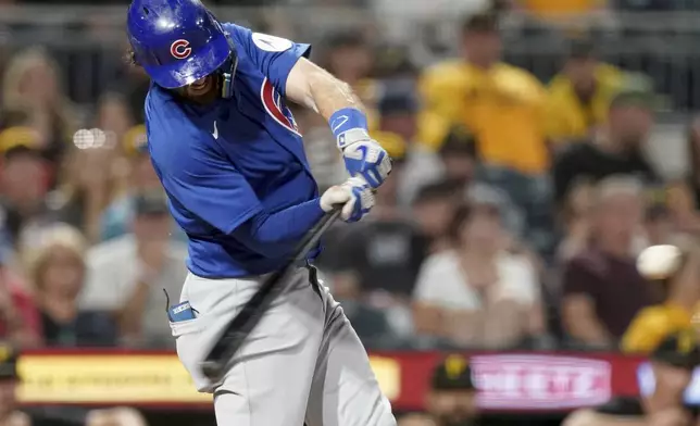 Chicago Cubs' Dansby Swanson hits a grand slam during the sixth inning of a baseball game against the Pittsburgh Pirates, Monday, Aug. 26, 2024, in Pittsburgh. (AP Photo/Matt Freed)