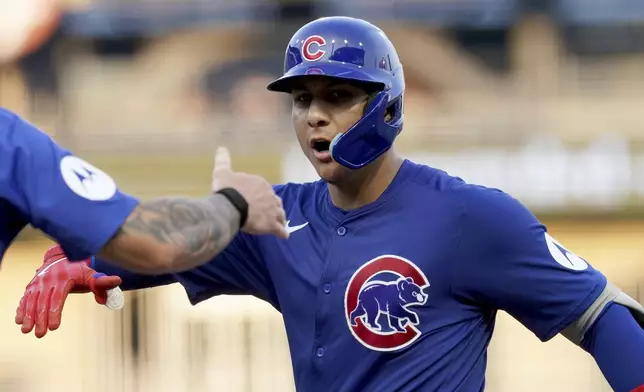 Chicago Cubs' Miguel Amaya celebrates after his RBI single during the second inning of a baseball game against the Pittsburgh Pirates, Monday, Aug. 26, 2024, in Pittsburgh. (AP Photo/Matt Freed)