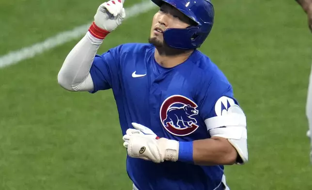 Chicago Cubs' Seiya Suzuki rounds the bases after hitting a two-run home run off Pittsburgh Pirates starting pitch Jared Jones during the fourth inning of a baseball game in Pittsburgh, Tuesday, Aug. 27, 2024. (AP Photo/Gene J. Puskar)