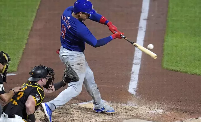 Chicago Cubs' Miguel Amaya singles off Pittsburgh Pirates relief pitcher Ben Heller, driving in two runs, during the fifth inning of a baseball game in Pittsburgh, Tuesday, Aug. 27, 2024. (AP Photo/Gene J. Puskar)