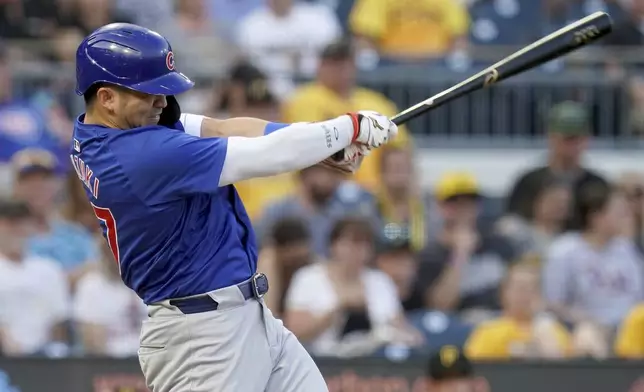 Chicago Cubs' Seiya Suzuki hits a ground rule double during the third inning of a baseball game against the Pittsburgh Pirates, Monday, Aug. 26, 2024, in Pittsburgh. (AP Photo/Matt Freed)