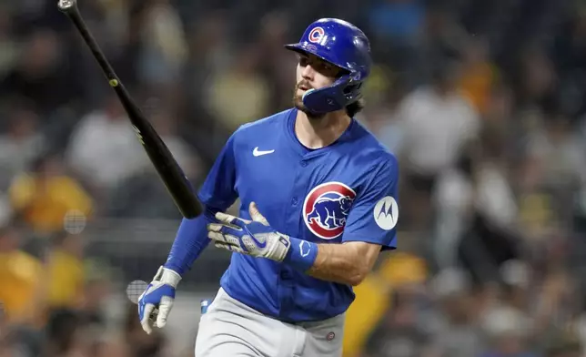 Chicago Cubs' Dansby Swanson tosses his bat after hitting a grand slam during the sixth inning of a baseball game against the Pittsburgh Pirates, Monday, Aug. 26, 2024, in Pittsburgh. (AP Photo/Matt Freed)