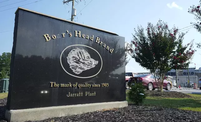 This sign marks the entrance of the Boar's Head processing plant that was tied to a deadly food poisoning outbreak Thursday Aug. 29, 2024, in Jarratt, Va. (AP Photo/Steve Helber)