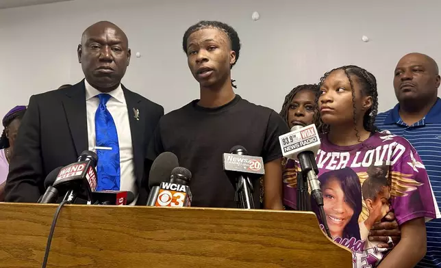 Malachi Hill Massey, 17, center, speaks at a news conference on Tuesday, July 23, 2024, at the NAACP headquarters in Springfield, Ill., about his mother, Sonya Massey, who was shot to death by a Sangamon County Sheriff's deputy on July 6 in Springfield after calling 911 for help. On the left is civil right attorney Ben Crump, who is representing the Massey family. On the right is Sonya Massey's daughter, Jeanette Summer Massey, 15. (AP Photo/John O'Connor)