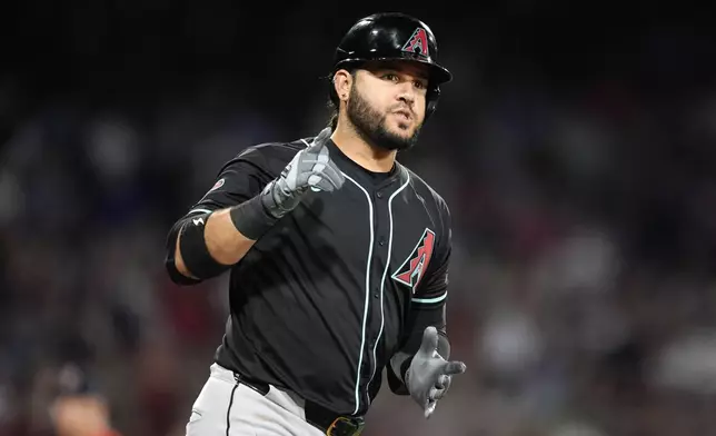 Arizona Diamondbacks' Eugenio Suárez runs on his grand slam during the seventh inning of a baseball game against the Boston Red Sox, Friday, Aug. 23, 2024, in Boston. (AP Photo/Michael Dwyer)