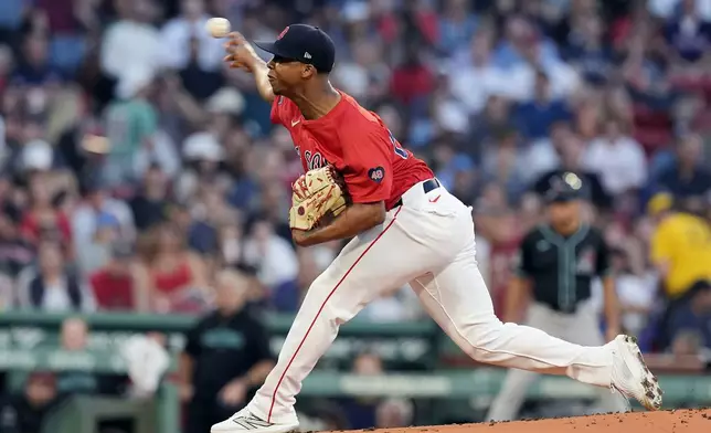 Boston Red Sox's starting pitcher Brayan Bello throws during the first inning of a baseball game against the Arizona Diamondbacks, Friday, Aug. 23, 2024, in Boston. (AP Photo/Michael Dwyer)