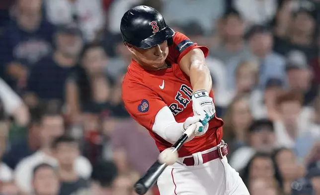 Boston Red Sox's Rob Refsnyder hits a solo home run during the sixth inning of a baseball game against the Arizona Diamondbacks, Friday, Aug. 23, 2024, in Boston. (AP Photo/Michael Dwyer)