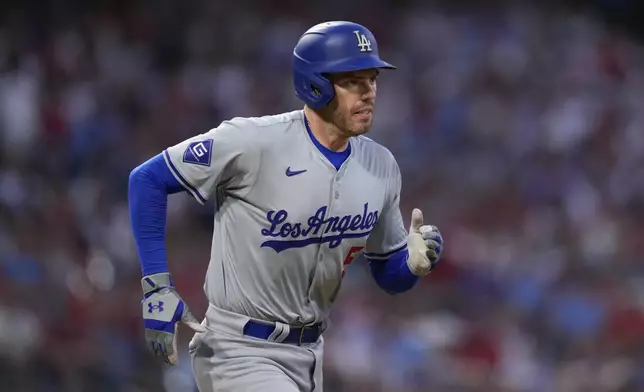 FILE - Los Angeles Dodgers' Freddie Freeman plays during a baseball game, Thursday, July 11, 2024, in Philadelphia. Freeman and his wife Chelsea said in a joint social-media post that their 3-year-old son Maximus is suffering from Guillain-Barre syndrome, a rare neurological disorder. (AP Photo/Matt Slocum)