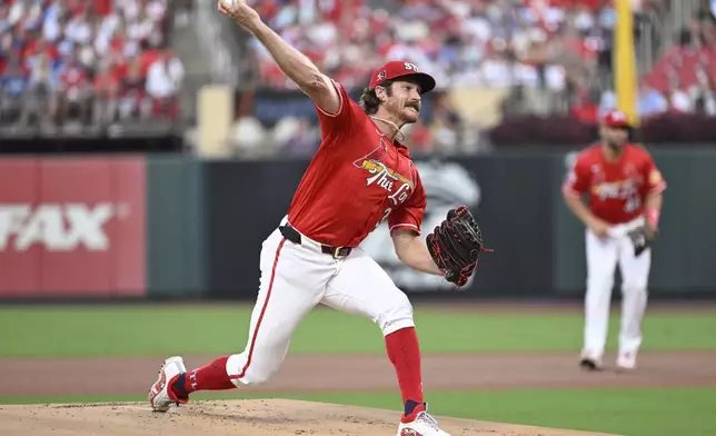 St. Louis Cardinals starting pitcher Miles Mikolas foreground, throws against the Los Angeles Dodgers during the first inning of a baseball game Friday, Aug. 16, 2024, in St. Louis. (AP Photo/Jeff Le)