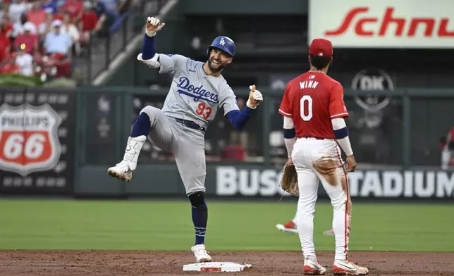 Los Angeles Dodgers' Kevin Kiermaier (93) reacts after advancing to second on a throwing error form St. Louis Cardinals right fielder Jordan Walker (not shown) during the first inning of a baseball game Friday, Aug. 16, 2024, in St. Louis. (AP Photo/Jeff Le)