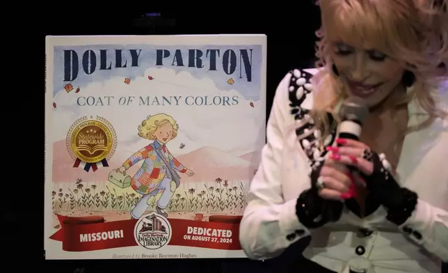 Dolly Parton addresses attendees at an event celebrating the Missouri statewide expansion of Dolly Parton's Imagination Library, Tuesday, Aug. 27, 2024, in Kansas City, Mo. (AP Photo/Charlie Riedel)