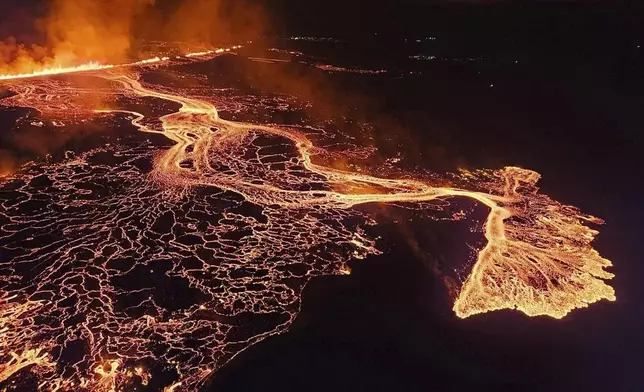 A volcano in southwestern Iceland erupted Thursday, Aug. 22, 2024, for the sixth time since December, spewing red lava through a new fissure on the Reykjanes Peninsula.( Iceland Civil Defense via AP)