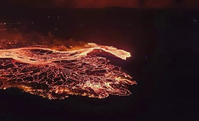 A volcano in southwestern Iceland erupted Thursday, Aug. 22, 2024, for the sixth time since December, spewing red lava through a new fissure on the Reykjanes Peninsula. (Iceland Civil Defense via AP)