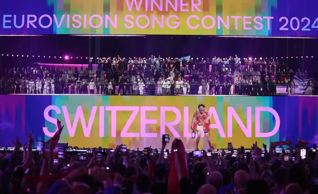 FILE -Nemo of Switzerland, who performed the song The Code, celebrates after winning the Grand Final of the Eurovision Song Contest in Malmo, Sweden, May 11, 2024. (AP Photo/Martin Meissner, File)