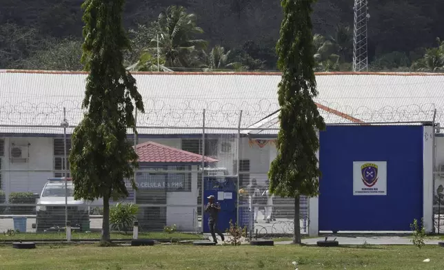 A staff walks outside the prison facility where defrocked American priest Richard Daschbach is serving his 12-year sentence for sex abuse, in East Timor, in Dili, East Timor, Tuesday, Aug. 13, 2024. (AP Photo/Achmad Ibrahim)