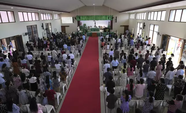 Parishioners attend a mass at a church in Dili, East Timor, Sunday, Aug. 11, 2024. (AP Photo/Achmad Ibrahim)