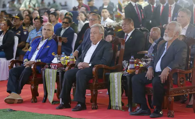 United Nations Secretary-General Antonio Guterres, center, is flanked by East Timorese President Ramos Horta, left, and Prime Minister Xanana Gusmao, right, as they attend the commemoration of the 25th year anniversary of the referendum that led to the country's independence from Indonesia, in Dili, East Timor, Friday, Aug. 30, 2024. (AP Photo/Carlos Caro Junior)