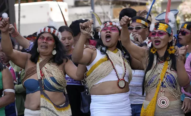 Waorani Indigenous women take part in a demonstration demanding authorities comply with the provisions of a popular consultation that puts an end to oil extraction in a sector of the Amazon where Indigenous people live, in Quito, Ecuador, Tuesday, Aug. 20, 2024. (AP Photo/Dolores Ochoa)