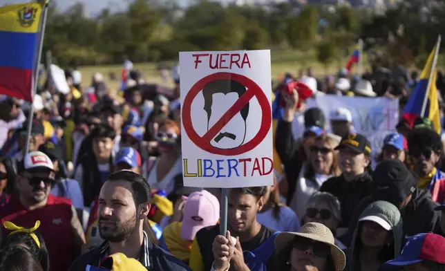 Venezuelan nationals protest against the results of their country's presidential election, in Quito, Ecuador, Saturday, Aug. 3, 2024. (AP Photo/Carlos Noriega)