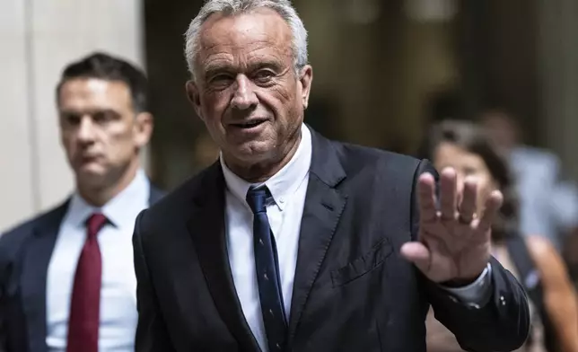 Independent presidential candidate Robert F. Kennedy Jr., waves to the media outside the Nassau County Supreme Court in Mineola, N.Y. on Wednesday, Aug., 21, 2024. (AP Photo/Stefan Jeremiah)