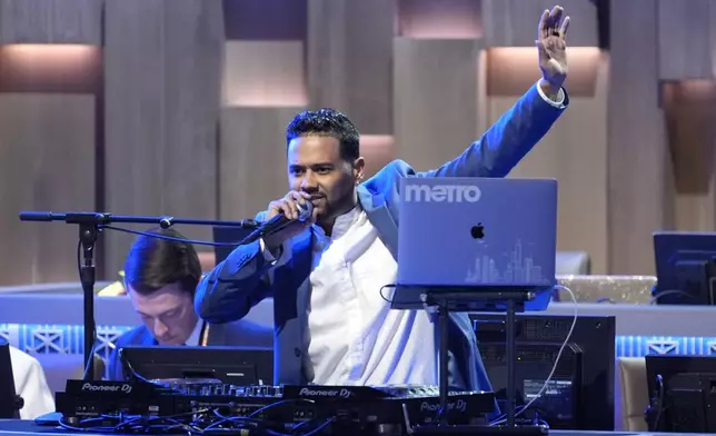 Chris Metro Matta, aka DJ Metro, performs during the Democratic National Convention Thursday, Aug. 22, 2024, in Chicago. (AP Photo/J. Scott Applewhite)