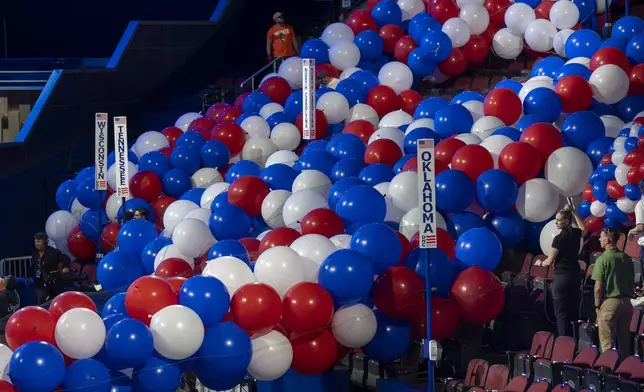 Workers prepare for next week's Democratic National Convention at the United Center in Chicago, Thursday, Aug. 15, 2024. (AP Photo/J. Scott Applewhite)