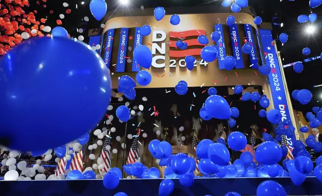 Balloons fall after the nomination of Democratic presidential nominee Vice President Kamala Harris and Democratic vice presidential candidate Minnesota Gov. Tim Walz during the Democratic National Convention Thursday, Aug. 22, 2024, in Chicago. (AP Photo/Paul Sancya)