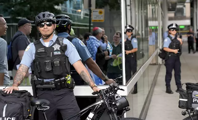 Police stage at a planned demonstrate near the Israeli Consulate during the Democratic National Convention Tuesday, Aug. 20, 2024, in Chicago. (AP Photo/Alex Brandon)