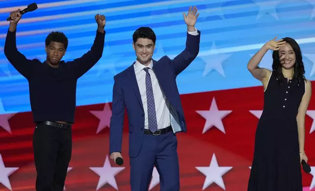 Alexander Hudlin, from left, Jasper Emhoff and Arden Emhoff wave after speaking during the Democratic National Convention Wednesday, Aug. 21, 2024, in Chicago. (AP Photo/J. Scott Applewhite)