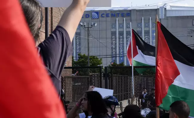 Protesters march to the Democratic National Convention at the United Center after a rally at Union Park Monday, Aug. 19, 2024, in Chicago. (AP Photo/Alex Brandon)