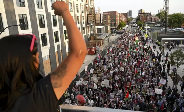 Protesters march during a demonstration outside the Democratic National Convention Wednesday, Aug. 21, 2024, in Chicago. (AP Photo/Noah Berger)