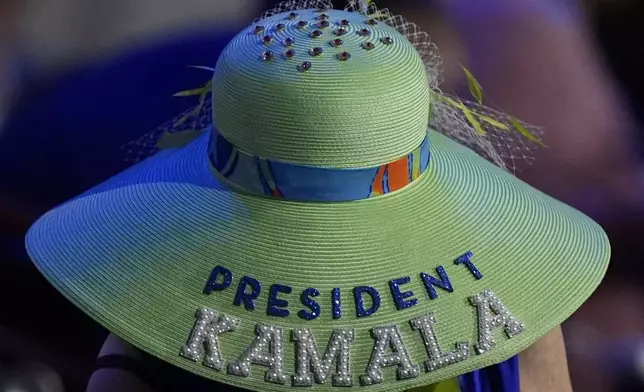 A woman wears a Kamala Harris hat during the Democratic National Convention Wednesday, Aug. 21, 2024, in Chicago. (AP Photo/Charles Rex Arbogast)