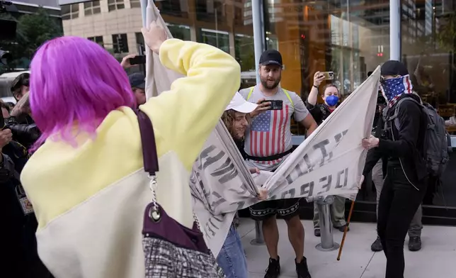 Demonstrators clash with counter protesters near the Israeli Consulate during the Democratic National Convention Tuesday, Aug. 20, 2024, in Chicago. (AP Photo/Alex Brandon)