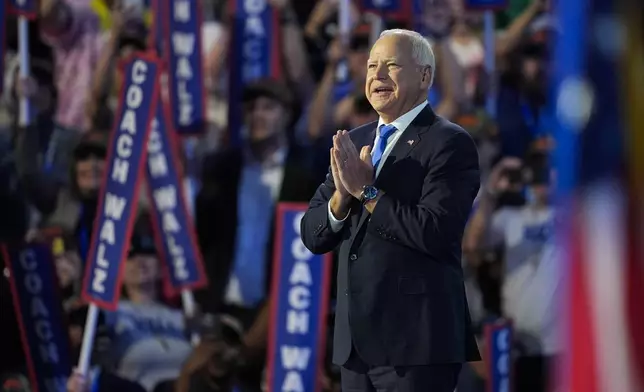 Democratic vice presidential nominee Minnesota Gov. Tim Walz speaks during the Democratic National Convention Wednesday, Aug. 21, 2024, in Chicago. (AP Photo/Charles Rex Arbogast)