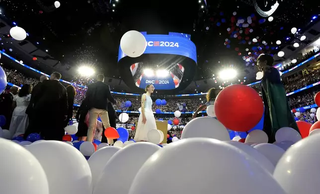 Balloons drop onto stage after Democratic presidential nominee Vice President Kamala Harris spoke on the final night of the Democratic National Convention in Chicago, Thursday, Aug. 22, 2024. (Kent Nishimura/The New York Times via AP, Pool)