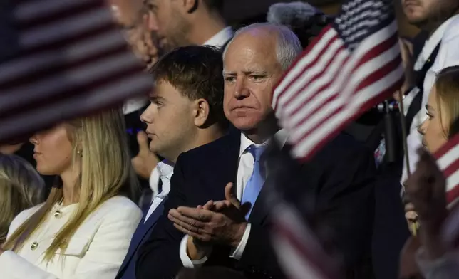 Democratic vice presidential nominee Minnesota Gov. Tim Walz claps during the Democratic National Convention Thursday, Aug. 22, 2024, in Chicago. (AP Photo/Matt Rourke)