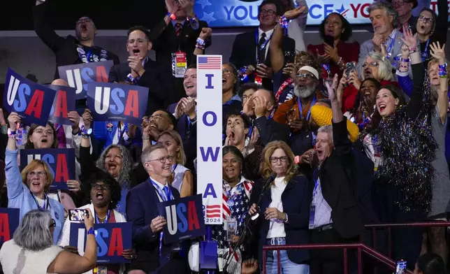 Members of the Iowa delegation cheering during roll call at the Democratic National Convention Tuesday, Aug. 20, 2024, in Chicago. (AP Photo/J. Scott Applewhite)