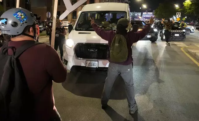 Protesters try to block traffic after a demonstration outside the Democratic National Convention Thursday, Aug. 22, 2024, in Chicago. (AP Photo/Alex Brandon)