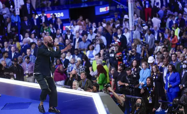 Common performs during the Democratic National Convention Tuesday, Aug. 20, 2024, in Chicago. (AP Photo/Matt Rourke)