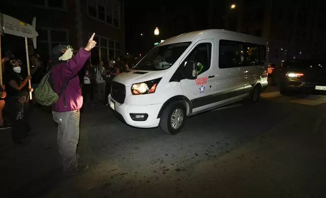 Protesters try to block traffic after a demonstration outside the Democratic National Convention Thursday, Aug. 22, 2024, in Chicago. (AP Photo/Julio Cortez)