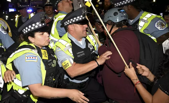 Protesters march during a demonstration outside the Democratic National Convention Thursday, Aug. 22, 2024, in Chicago. (AP Photo/Noah Berger)