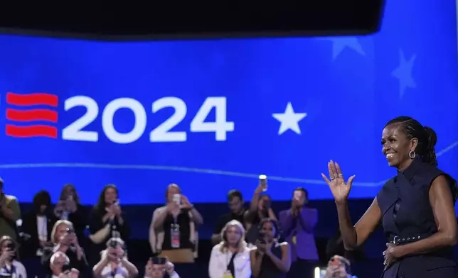 Former first lady Michelle Obama speaks during the Democratic National Convention Tuesday, Aug. 20, 2024, in Chicago. (AP Photo/Brynn Anderson)