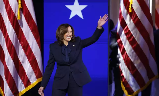 Democratic presidential nominee Vice President Kamala Harris waves during the Democratic National Convention Thursday, Aug. 22, 2024, in Chicago.(Gabrielle Lurie/San Francisco Chronicle via AP)