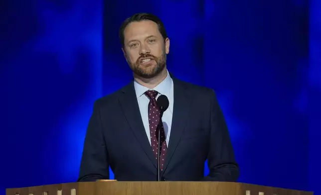 Jason Carter, former President Jimmy Carter's grandson, speaks during the Democratic National Convention on Tuesday, Aug. 20, 2024, in Chicago. (AP Photo/J. Scott Applewhite)